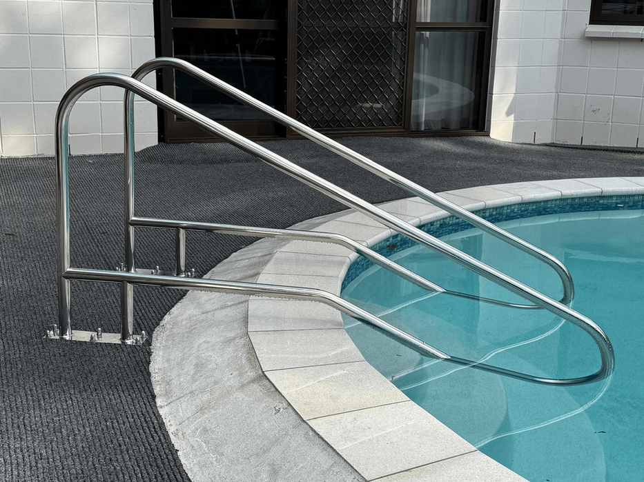 Stainless steel pool handrail and entry rail installed on round residential pool by Aquatech, Auckland, New Zealand