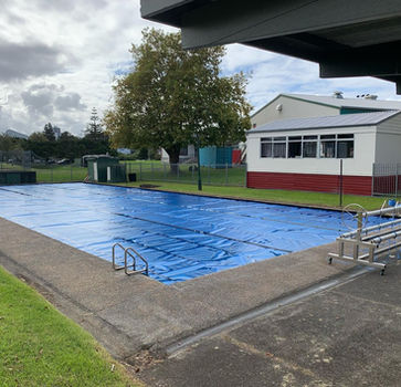 Aquatech commercial solar bubble pool cover installed on Auckland school pool with roller system, New Zealand