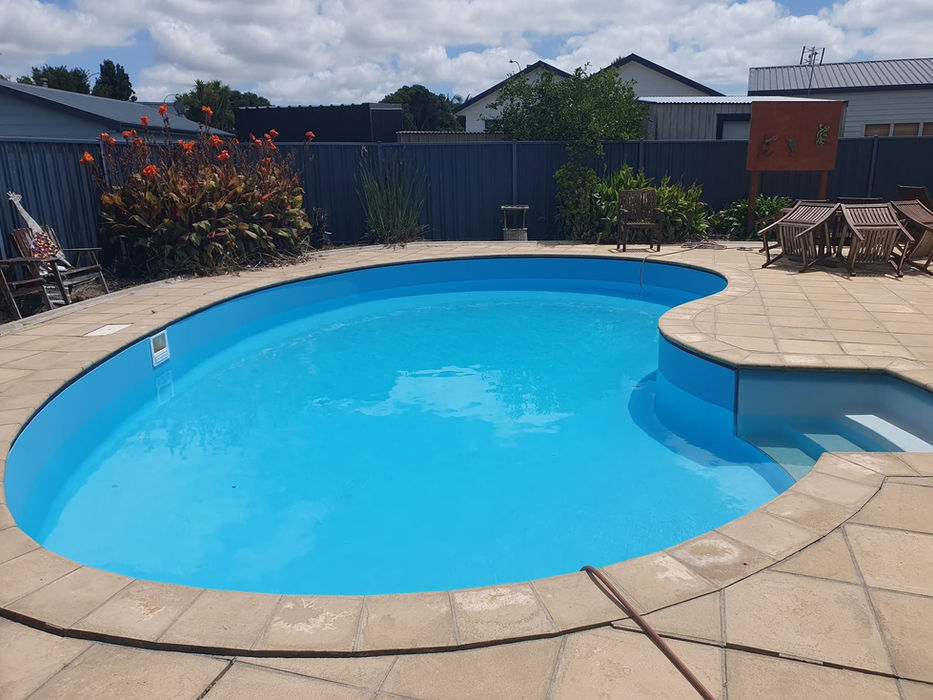 Kidney-shaped pool with new liner and adjoining spa, Auckland