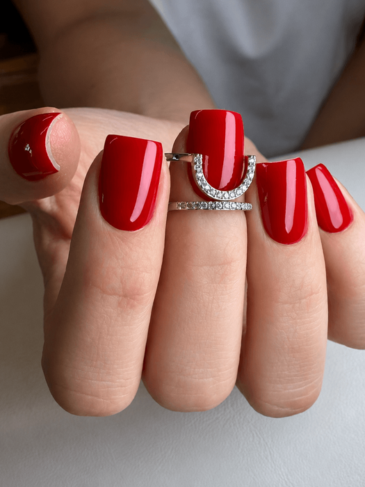 close-up photo of beautiful red pedicure
