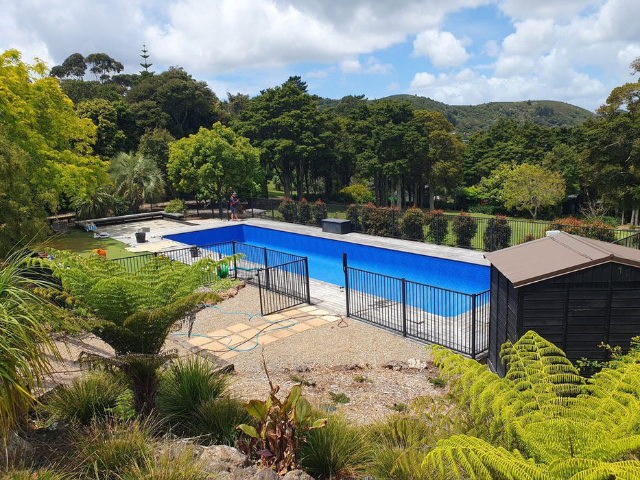 Aerial view of fenced rectangular pool with new liner, Auckland