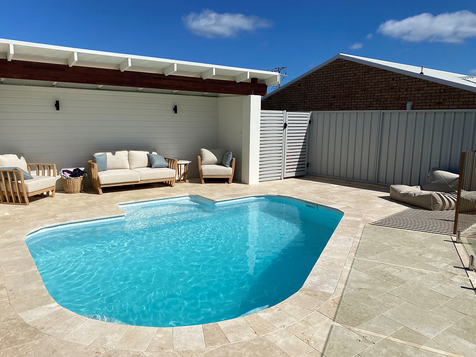 Aqualux vinyl pool liner NZ kidney-shaped pool with paved surround
