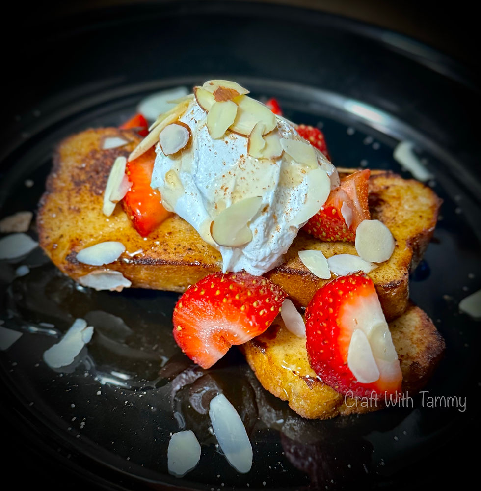 Keto French Toast topped with sugar free syrup, whipped cream and fresh berries