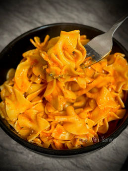 Golden, bubbly egg noodle casserole topped with melted cheese