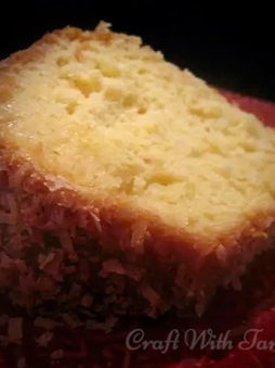 Buttery coconut crunch cake topped with silky coconut glaze and toasted coconut flakes