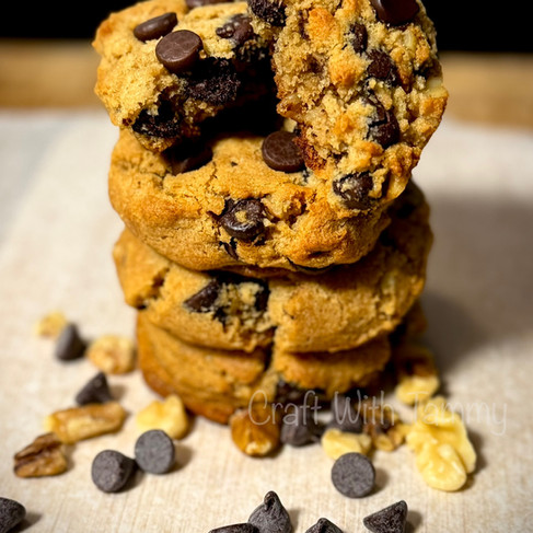 Stack of keto chocolate chip cookies on parchment paper