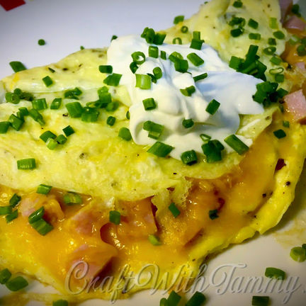 Fluffy chef-style omelet folded and filled with cheese and herbs