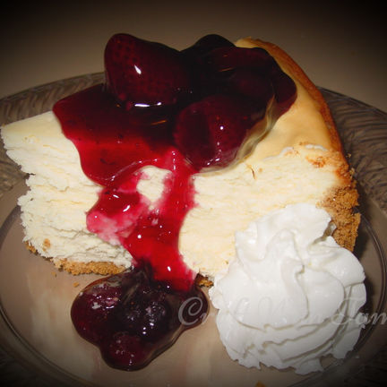 New York cheesecake with golden crust and whipped topping
