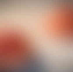 Cheesecake-filled cookie dough balls on baking sheet