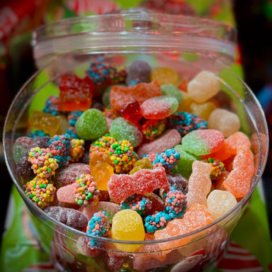Colorful candy salad made with assorted gummy and sour candies in a large bowl