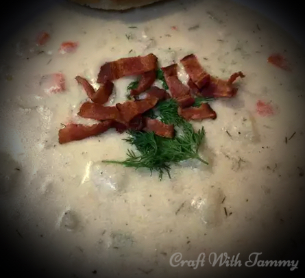 “Ingredients for homemade clam chowder including clams, potatoes, bacon, onions, herbs and cream”