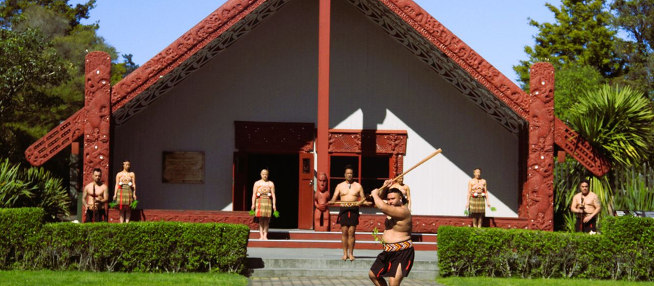Visitors being welcomed during an authentic Māori cultural experience at a marae in New Zealand.