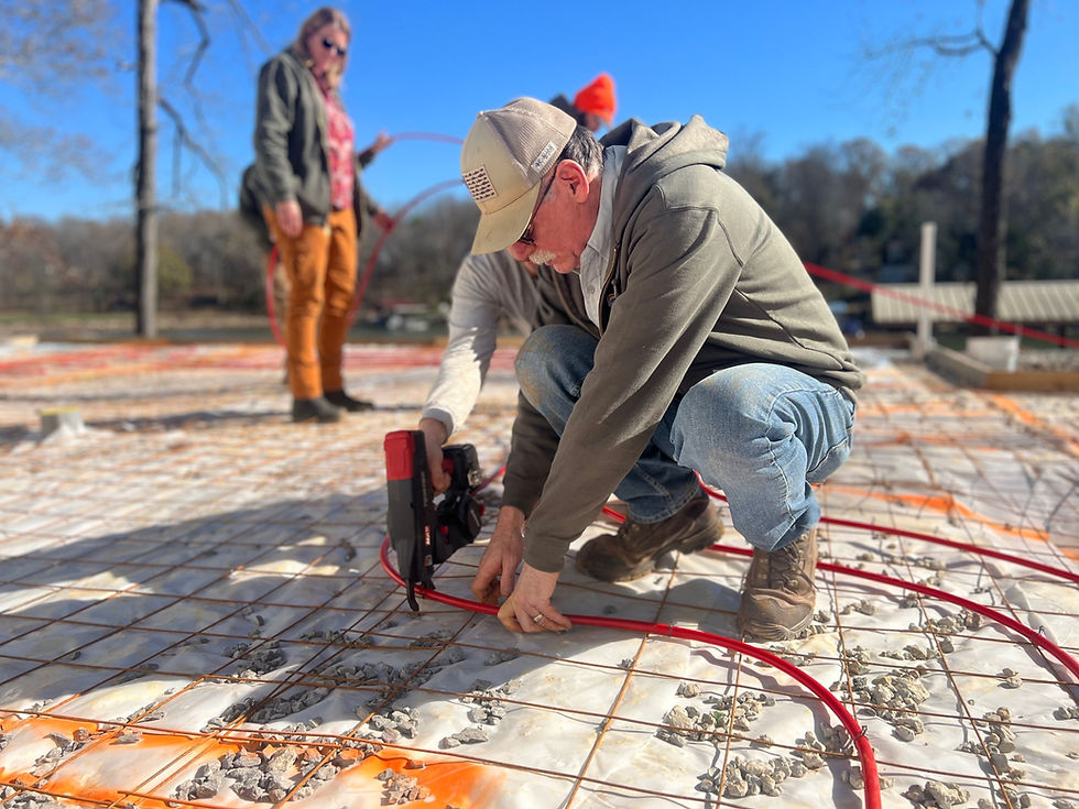 John giles of scenic air solutions installing radiant pex tubing for heated floors