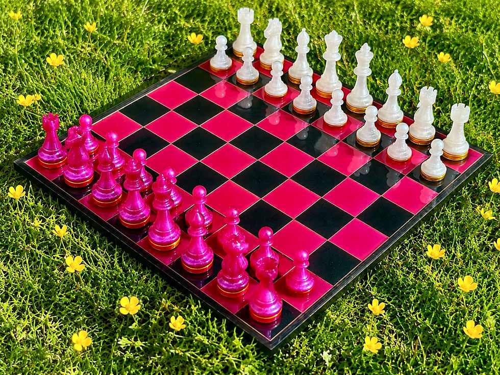 Fuchsia and black chess board with fuchsia and white chess pieces