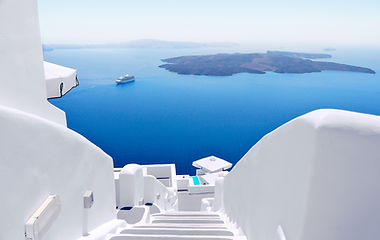 The Island of Santorini. Showing the 600 steps from the village of Fira going to the port. The blue sea and the Island of Kameni in the horizon.