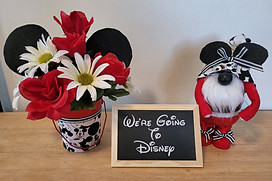 We're going to disney. Mickey Mouse floral arrangment and gnome