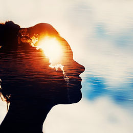 Mental Health - silhouette of a face on a blue sky background