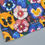 Thumbnail: An image of an unfolded printed tea towel, with a blue and purple pansy print