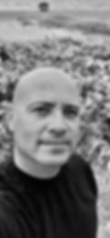 Black and white photo of the author, George K. Karos II.