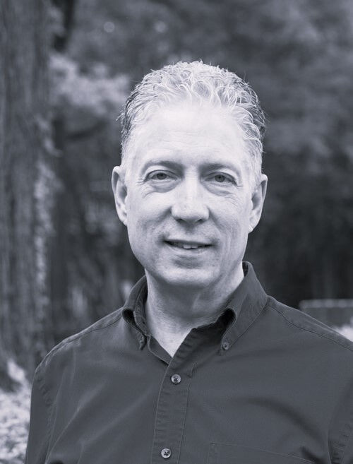 Black and white photo of the author Todd Matson