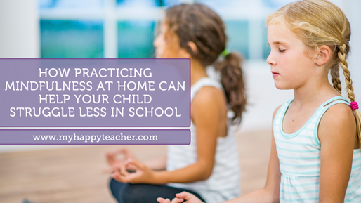 Two young girls practicing mindfulness or meditation. One girl with blonde braids is visible in the foreground, sitting with eyes closed. Another girl with brown hair is partially visible in the background. Text overlay reads: 'How practicing mindfulness at home can help your child struggle less in school' with website www.myhappyteacher.com