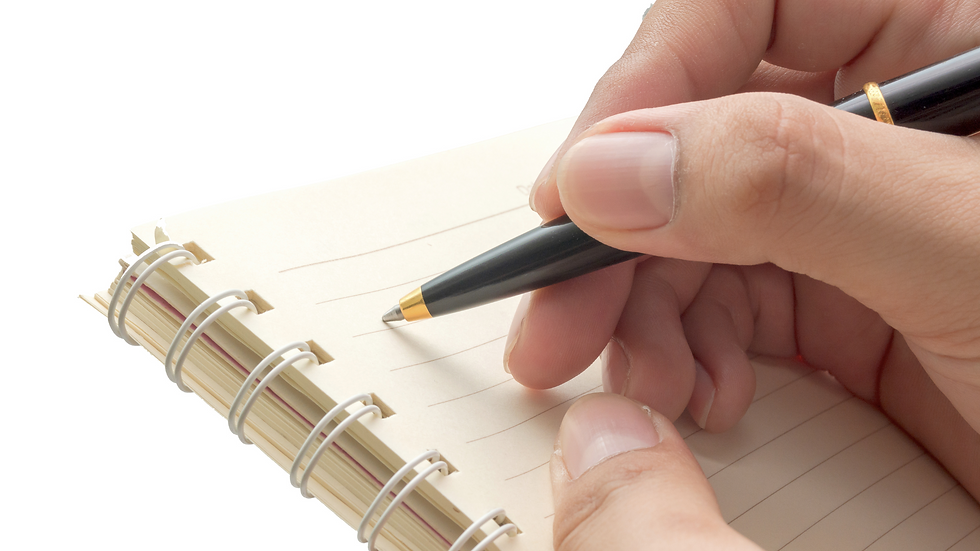 Close-up of a hand holding a pen, poised to write in a spiral-bound notebook with lined paper. The image suggests note-taking, planning, or organizing information.