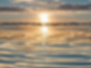 Ripples on the ocean with a reflection of the sun.jpg