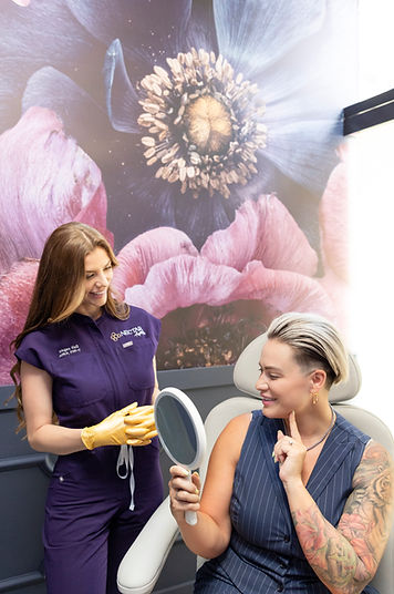 megan looking at her cheek filler patient