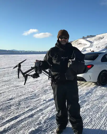 Aaron Donaldson, CASA-licensed drone pilot, with a DJI Inspire 2 on an alpine shoot