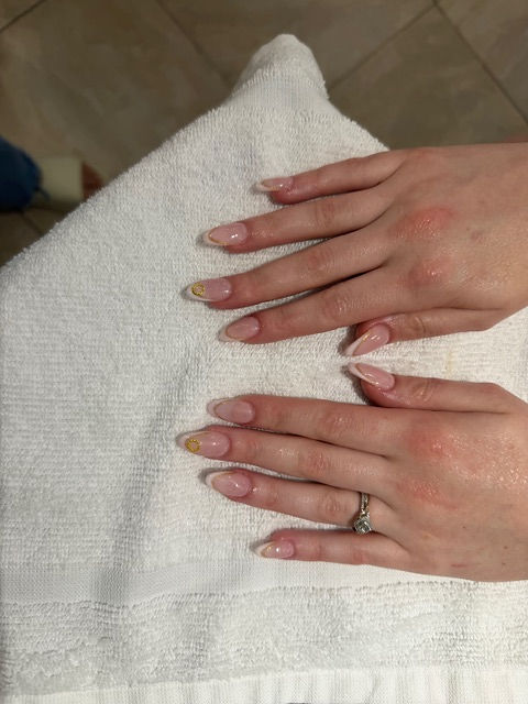 Hands with natural nails at a nail salon
