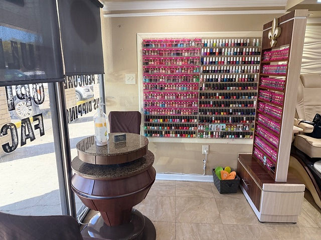 Bright interior of a nail salon with colorful polishes