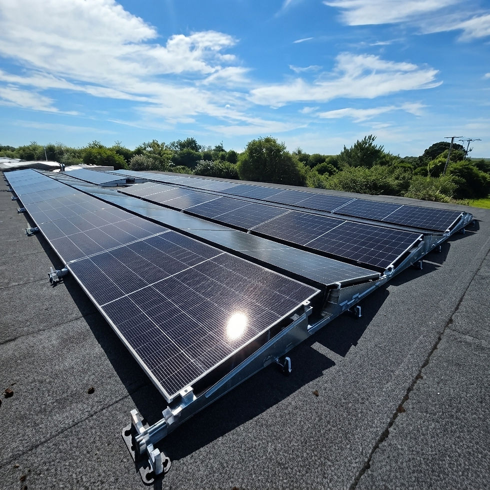Engineer with a tablet inspects a solar panel inverter on a modern building exterior.