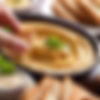 dipping bread into hummus in restaurant_edited.jpg