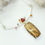 Thumbnail: Copper Rutilated Quartz, Garnet and White Topaz pendant in 14k Gold and Sterling