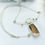Thumbnail: Copper Rutilated Quartz, Garnet and White Topaz pendant in 14k Gold and Sterling