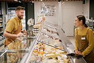 discussing-product-options-at-local-cheese-shop-co-2025-04-29-03-42-50-utc.jpg