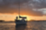 man-small-yacht-sunset-light.jpg