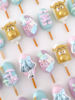 Alice in wonderland cake pops.jpeg