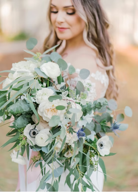 Beautiful bride with custom floral bouquet planned by Brey and Co.