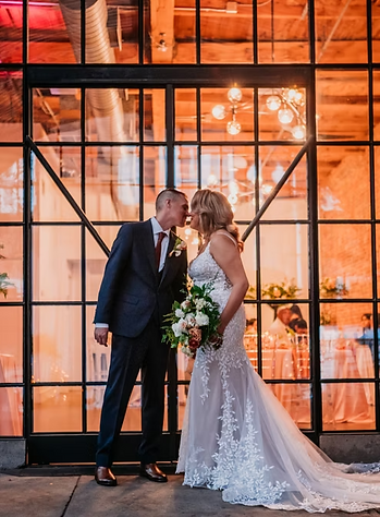 Newlyweds celebrating at modern Houston venue, planned with full-service wedding coordination.