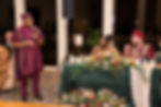 Wedding guest giving speech at Nigerian wedding ceremony.
