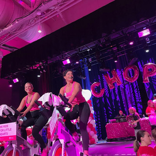 Girl riding bike on stage at event