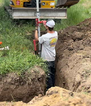 Checking grade for sewage drain pipe install
