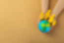 top-view-hands-holding-world-globe.jpg