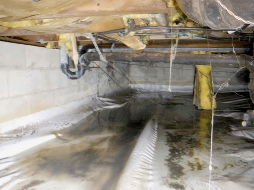 A damp crawlspace showing signs of moisture damage due to a water main break. Photo taken by CrawlspaceSolutionsNJ.com