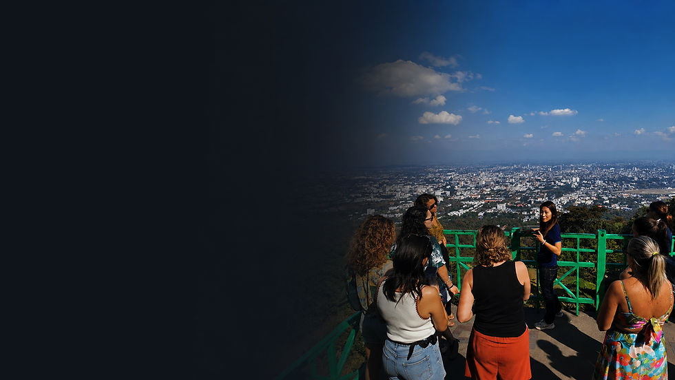 Local guide explaining Chiang Mai from a mountain viewpoint.