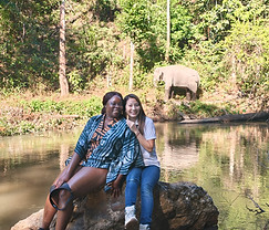 Solo traveler enjoying an elephant experience with guide Chay in Chiang Mai.