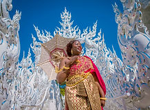 Traveler visiting the White Temple in Chiang Rai during a private cultural tour.