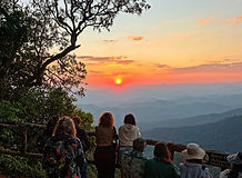 Travelers watching the sunset from Doi Suthep overlooking Chiang Mai.