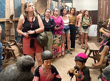 Travelers visiting a Hmong village near Doi Suthep in Chiang Mai and learning about local culture.